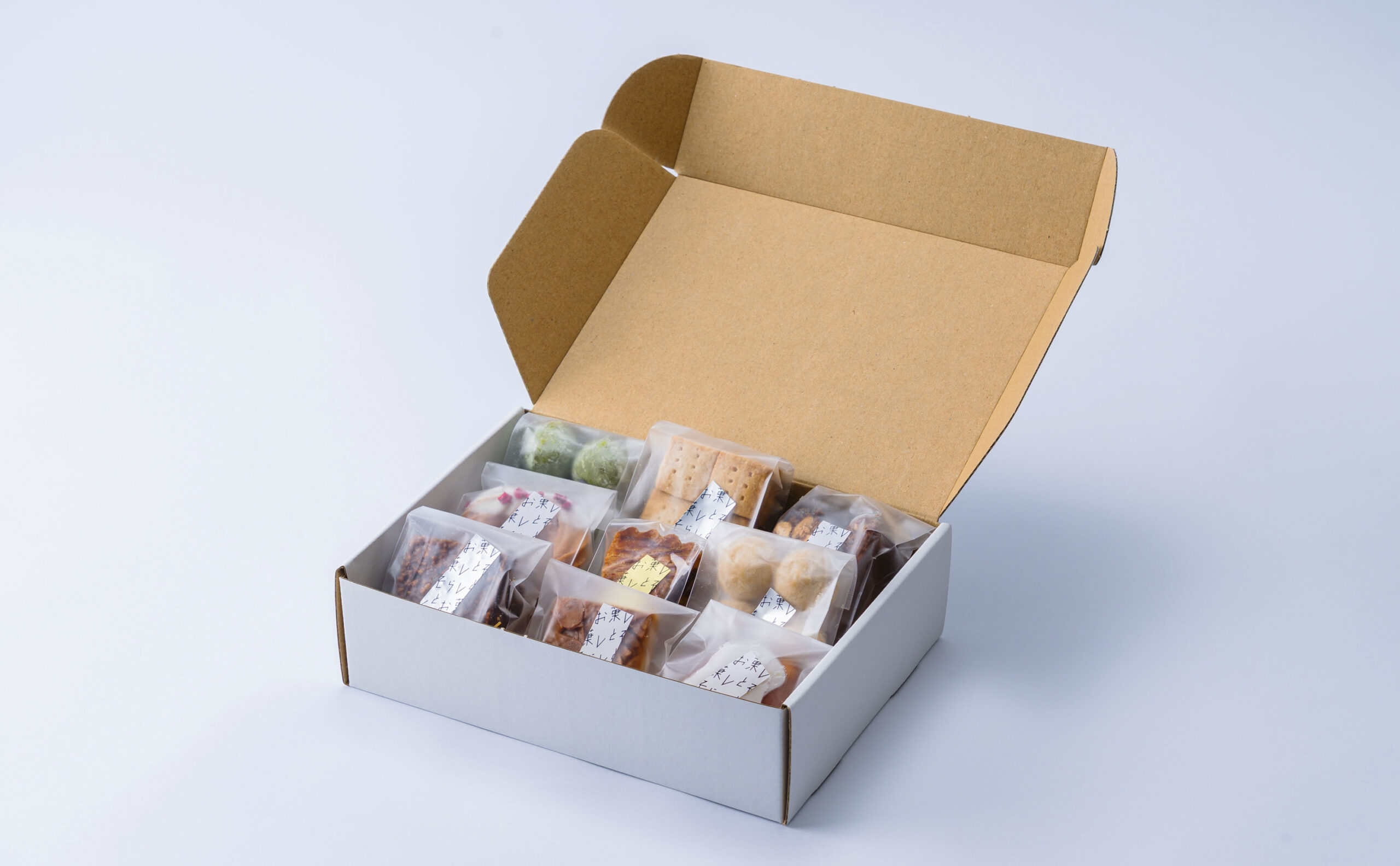 お菓しとそらしと　ロゴとパッケージ